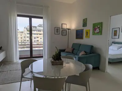 a living room with a table and a couch at Apartament and suite cavour 106 in Palermo