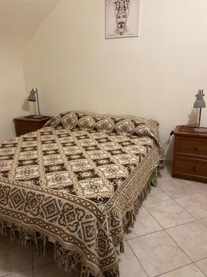 a bed in a room with a bedspread on it at Alle spalle della cattedrale in Palermo