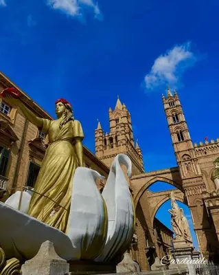 a statue of a woman in front of a building at Alle spalle della cattedrale in Palermo