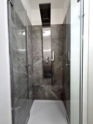 a shower stall with a glass door in a bathroom at Vicoletto Ludovica - Proppro SRL- Palermo in Palermo