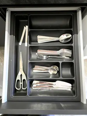 a drawer filled with silver utensils in a cabinet at Vicoletto Ludovica - Proppro SRL- Palermo in Palermo