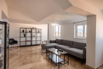a living room with a couch and a table at Ruggero City View apartment by Wonderful Italy in Palermo
