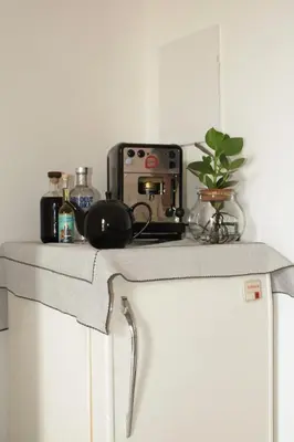 a counter top with a toaster and a plant on it at Mondello bed & beach in Palermo