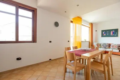 a dining room with a table and chairs at LuminArt in Nuova Gibellina