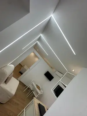 a living room with white furniture and a white ceiling at Glamour home in Palermo