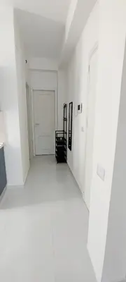 an empty room with white walls and a white hallway at Casa Viola - Central Apartment City & Sea in Alcamo
