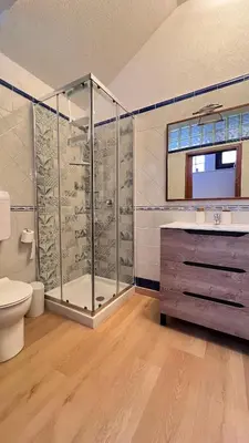 a bathroom with a shower and a toilet and a sink at Kasa Mondello in Mondello