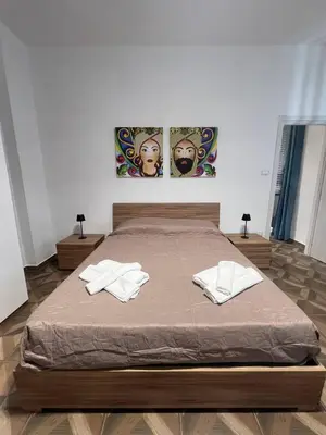 a bedroom with a bed with two white towels on it at Trinacria in Capaci