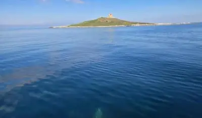 an island in the middle of a large body of water at Trinacria in Capaci
