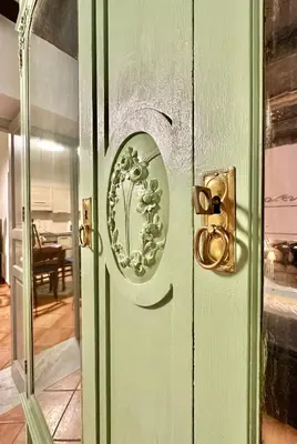 a green door with a round design on it at Casetta Nenè - Palermo Centrocittà - Intero Appartamento in Palermo