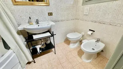 a bathroom with a sink and a toilet at Casetta Nenè - Palermo Centrocittà - Intero Appartamento in Palermo