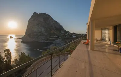 a balcony of a house with a view of the ocean at Seaside Villa Capo Zafferano in Bagheria