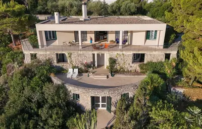 an aerial view of a house with a stone wall at Seaside Villa Capo Zafferano in Bagheria