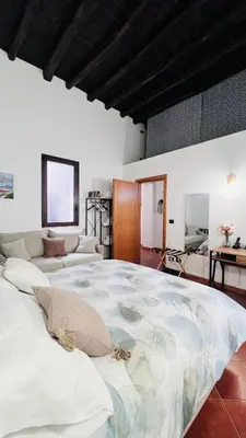 a large bedroom with a large bed in a room at Kasa Magnisi in Palermo