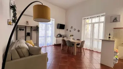 a living room with a couch and a table at Kasa Magnisi in Palermo