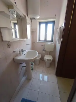 a bathroom with a sink and a toilet at Casa Mille in Palermo