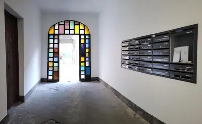 a mirror hanging on a wall in a room at Elvira Studio Flat,Via Dante,near Lolli station in Palermo