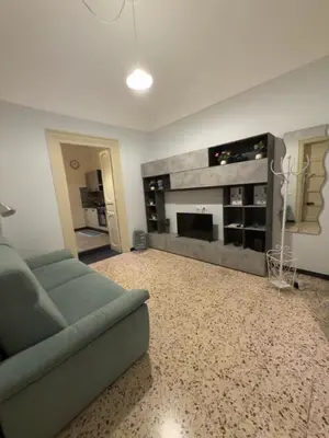 a living room with a couch and a fireplace at Casa marchese ,vacanze in centro -by Rentalbeb italy- in Palermo