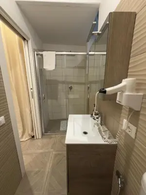 a bathroom with a sink and a shower at Casa marchese ,vacanze in centro -by Rentalbeb italy- in Palermo