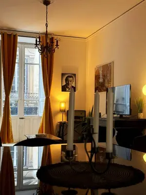 a living room with a table with candles on it at Luxury Apartment Palazzo Vannucci in Palermo