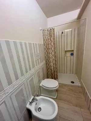 a bathroom with a toilet and a sink at Donna Maria in Cinisi