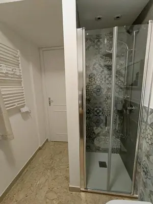 a shower with a glass door in a bathroom at Le meraviglie di Palermo Casa Vacanze Holiday House in Palermo