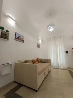 a living room with a couch in a room at Le meraviglie di Palermo Casa Vacanze Holiday House in Palermo