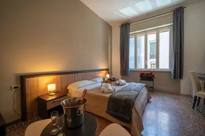 a hotel room with a bed and a window at La zagara di Alba in Palermo