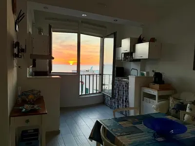 a kitchen with a view of the ocean from a room at Sea Pearl House in Isola delle Femmine
