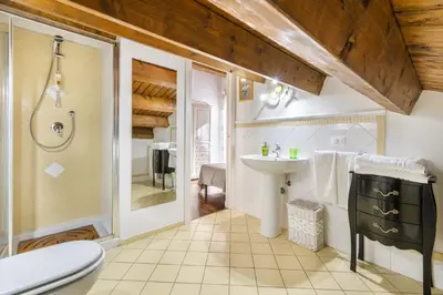 a bathroom with a sink and a toilet at Villa Bouganville in Monreale