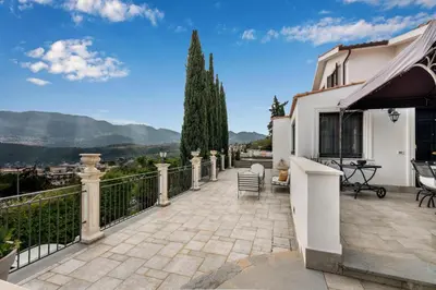 a balcony with a view of a house at Villa Bouganville in Monreale