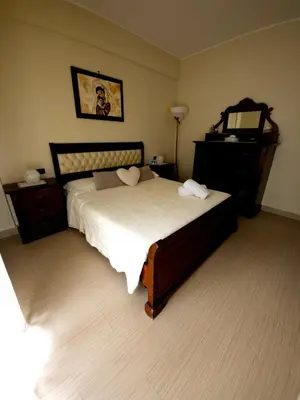 a bedroom with a bed and a dresser at La Casa Di Ady in Palermo