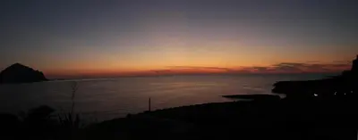 a sunset over a body of water at Bovio guest House in Castellammare del Golfo