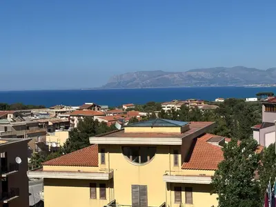 a view of a city with the ocean in the background at Appartamento Vista Golfo in Castellammare del Golfo