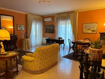 a living room with a couch and a table at Appartamento Vista Golfo in Castellammare del Golfo