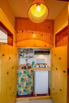 a small kitchen with a sink and a light at Appartamento vista mare in Castellammare del Golfo