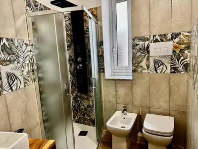 a bathroom with a sink and a toilet at Regina Rooms in Palermo