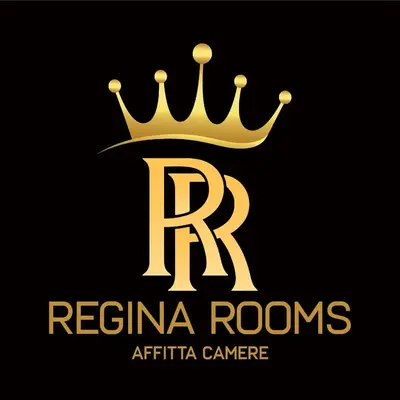 a bedroom with a bed with towels on it at Regina Rooms in Palermo