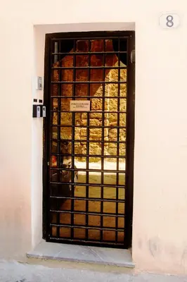 a door in a building with a bunch of bread at Damiani Case Vacanze Palermo - Centro Storico in Palermo