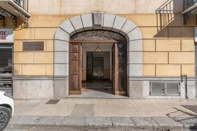an entrance to a building with an archway at Kadì Apartment by Wonderful Italy in Palermo
