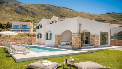 a villa with a swimming pool and a mountain at VILLA AGLEA Luxury By Sicily Home Solutions in Castellammare del Golfo