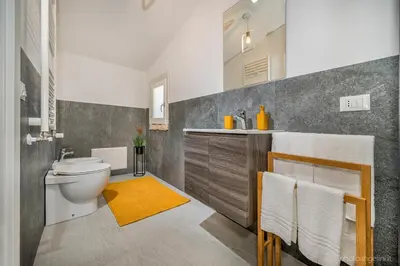 a bathroom with a toilet and a sink at VILLA AGLEA Luxury By Sicily Home Solutions in Castellammare del Golfo
