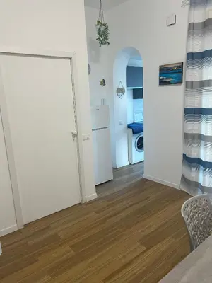 a room with a door leading to a bathroom at GFL Mondello - Appartamenti vista mare in Mondello