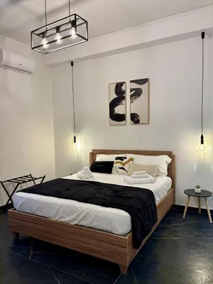 a bedroom with a large bed in a room at Renda36 in Carini