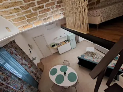 an overhead view of a living room with a couch and a table at Relaxing Room in Terrasini