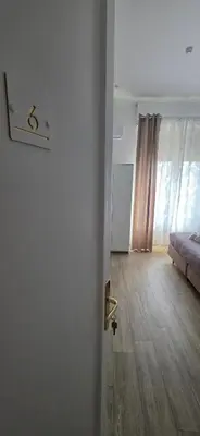 a bedroom with a bed with two towels on it at Hostel Josef in Palermo