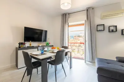 a bedroom with a bed with two pillows on it at Casa Antonio in Palermo