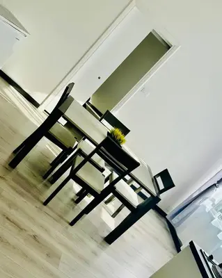 a table and chairs sitting in front of a window at Florio Suite Apartment in Palermo