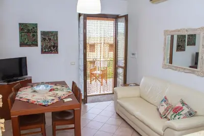 a living room with a couch and a table at euforbia in San Vito lo Capo