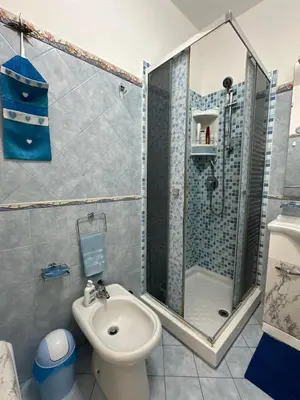 a bathroom with a shower and a toilet and a sink at La Perla Di Campofelice in Campofelice di Roccella